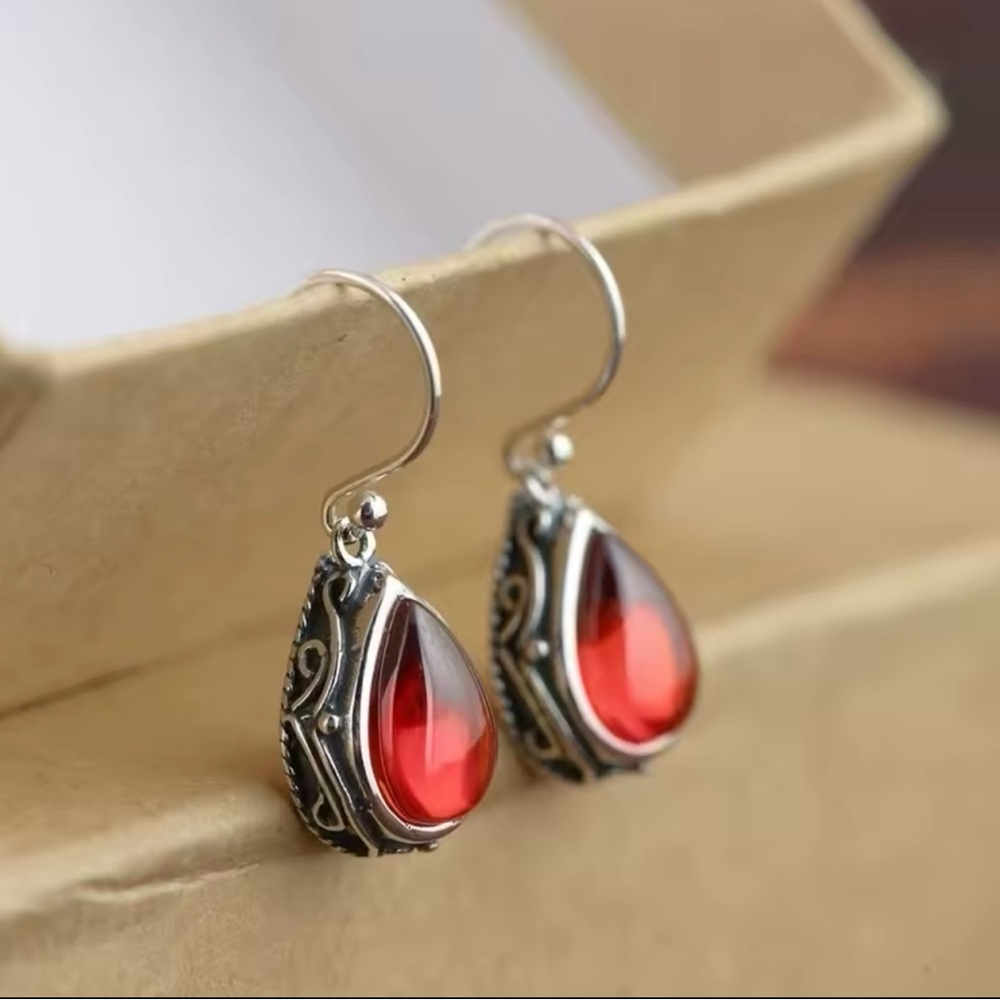 Vibrant Red Dangle Earrings with Teardrop Design and Antique Setting